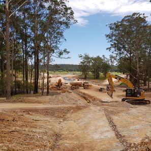 Development Management project underway with earth moving machinery at work on site