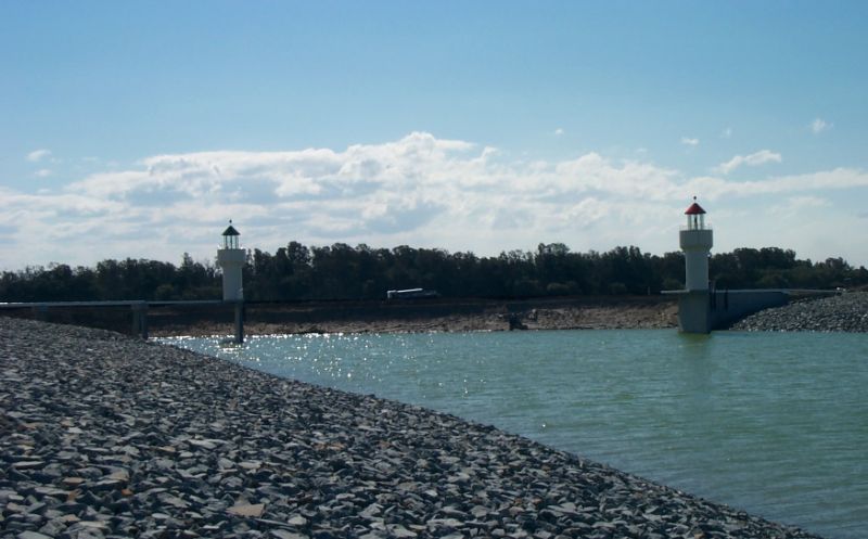 Settlement Shores View Of Water’s Edge And Bridge Settlement Shores View Of Water