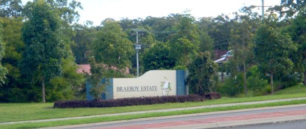 Braeroy Estate entrance Braeroy Estate entrance with sign, road and trees